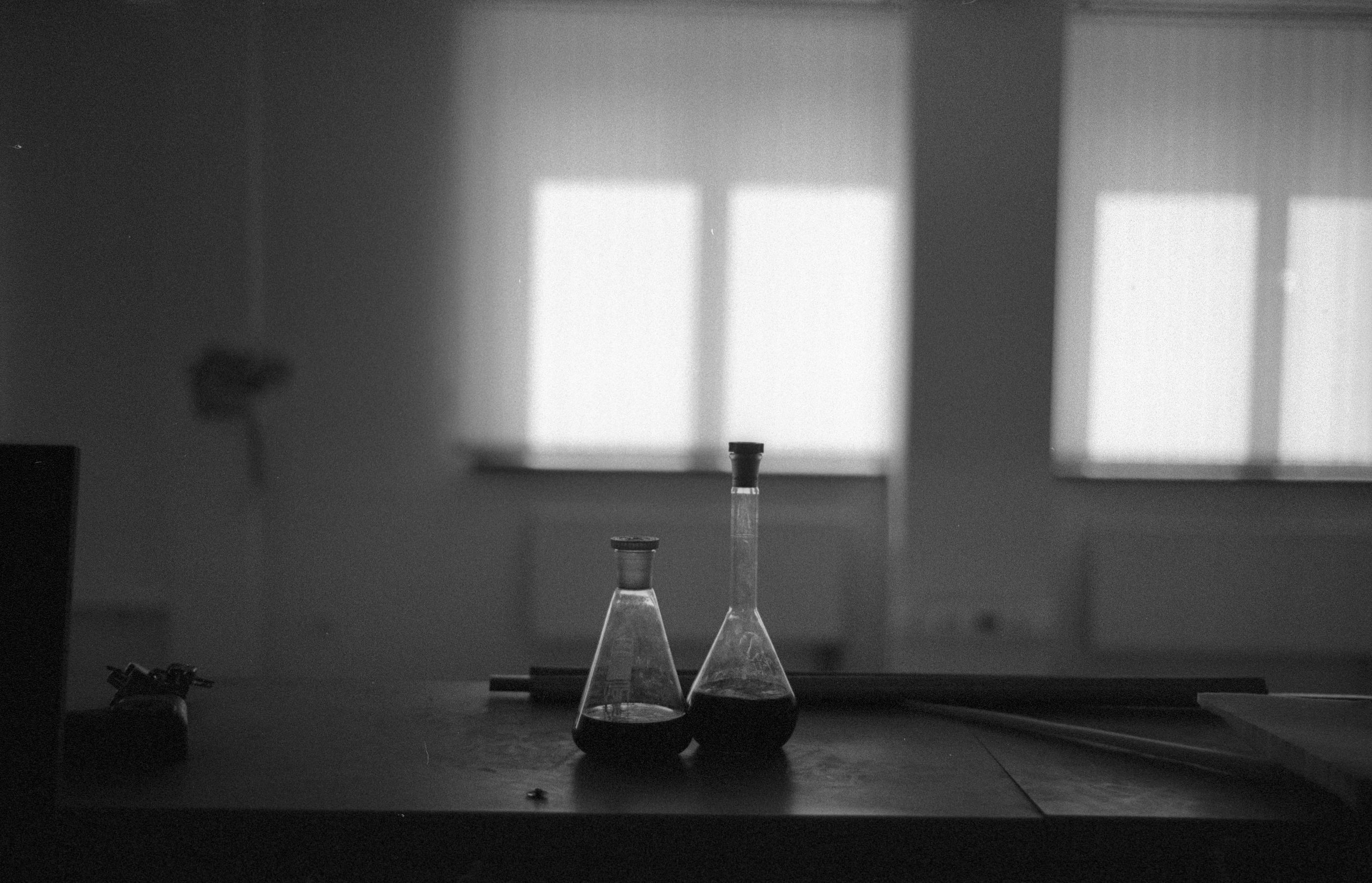 Black and white laboratory vials arranged for scientific research